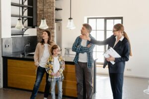 Family with designer in modern kitchen